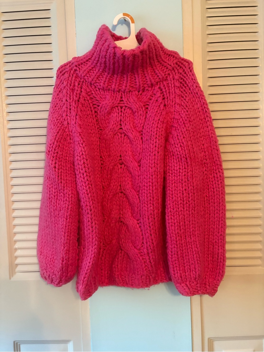 Very pretty beautifully knit hot pink sweater.